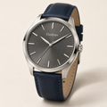 Danlous Horizon, round silver-tone case, slate-gray dial, baton markers and navy leather-look strap, main studio view