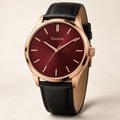 Danlous Rosso, round rose-gold-tone case, burgundy dial, baton markers and black leather-look strap, main studio view